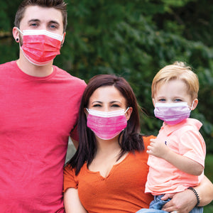 Family wearing masks in red, hot pink, and lavender